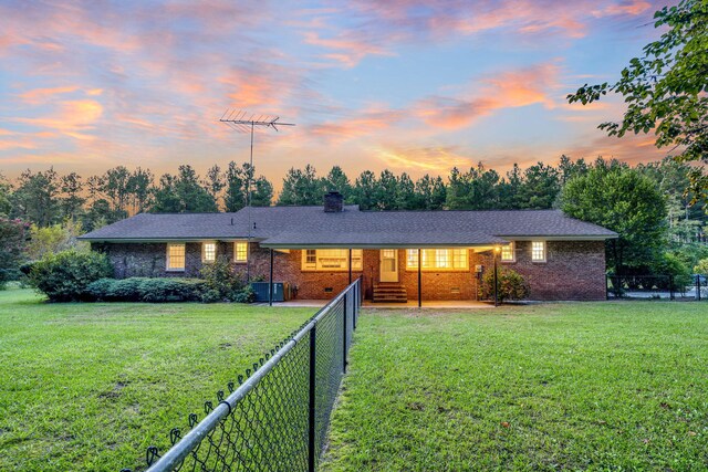 single story home with a front yard, fence private yard, brick siding, and crawl space