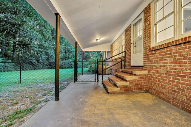 view of patio / terrace featuring entry steps, fence, and a gate