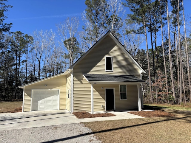 view of front facade featuring an attached garage and concrete driveway