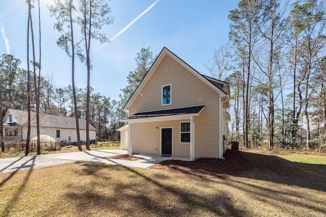 rear view of property with a yard