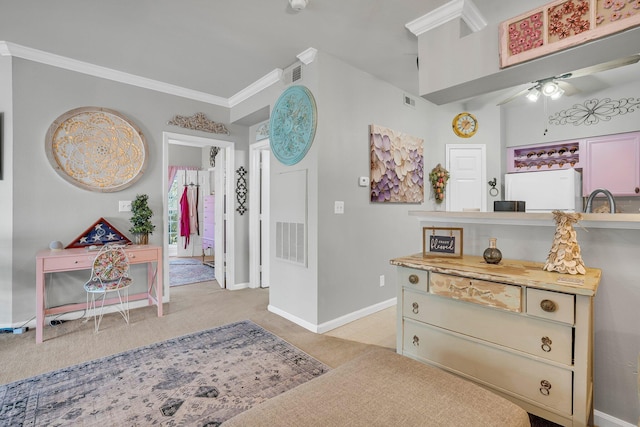 interior space featuring sink and crown molding