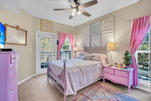 carpeted bedroom with ceiling fan and access to outside