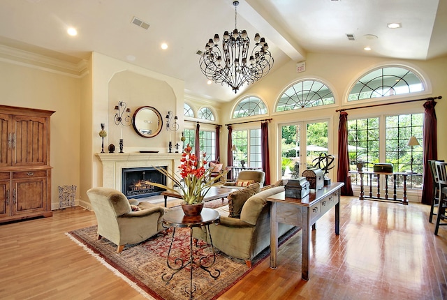 living room with high vaulted ceiling, a notable chandelier, french doors, beamed ceiling, and light wood-type flooring