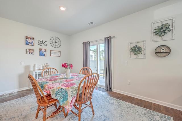 dining space featuring hardwood / wood-style flooring