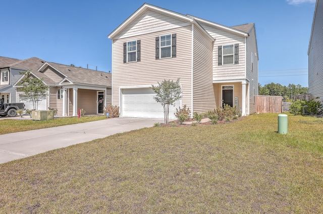 view of property featuring a garage and a front lawn