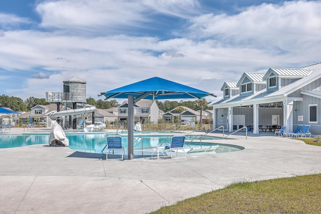 view of swimming pool featuring a patio area