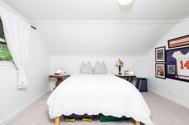 bedroom featuring baseboards, vaulted ceiling, and light colored carpet