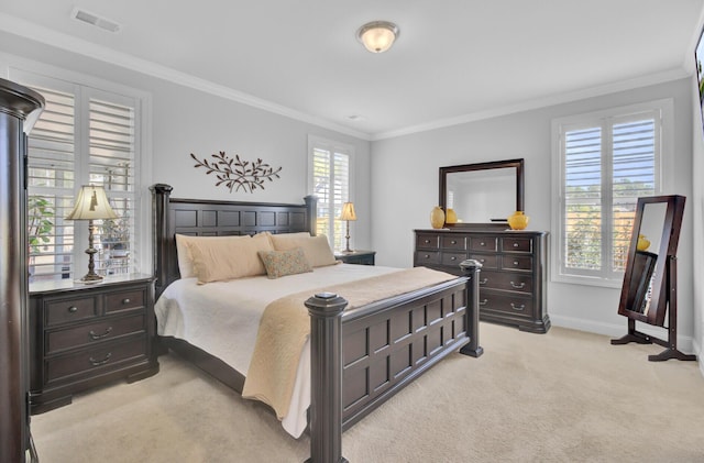 carpeted bedroom with ornamental molding