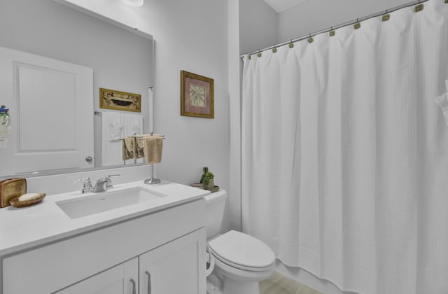 bathroom with vanity, a shower with curtain, and toilet