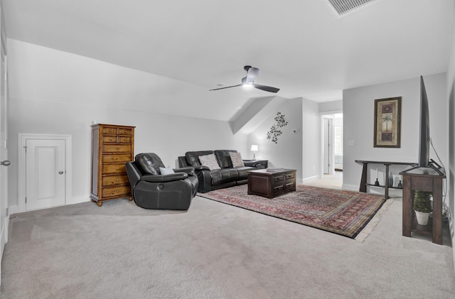 living room with ceiling fan, lofted ceiling, and light carpet