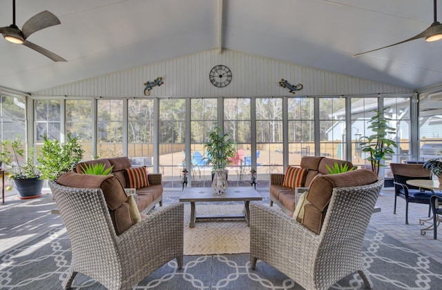 sunroom with ceiling fan and vaulted ceiling