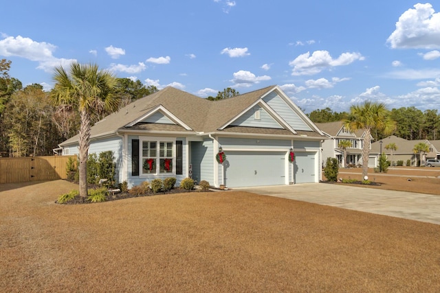 craftsman-style home featuring a garage and a front yard