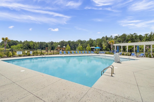 view of swimming pool with a pergola