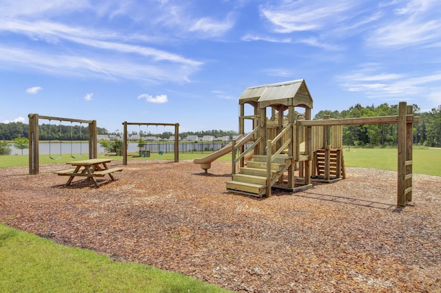 view of jungle gym with a water view