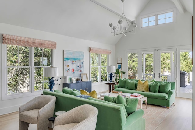 living room with an inviting chandelier, french doors, beam ceiling, high vaulted ceiling, and light wood-type flooring