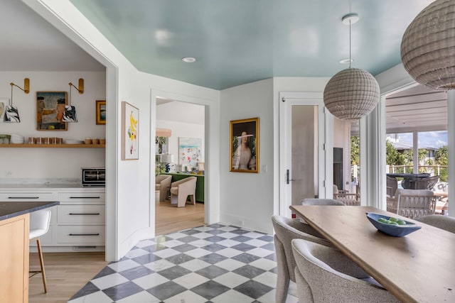 dining room with hardwood / wood-style flooring