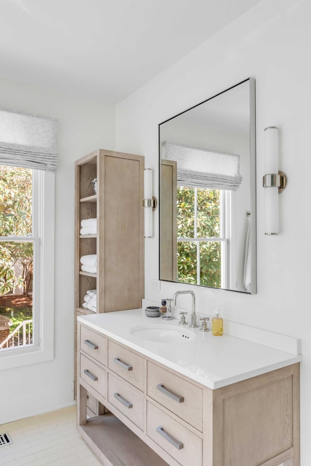 bathroom with vanity and tile patterned floors