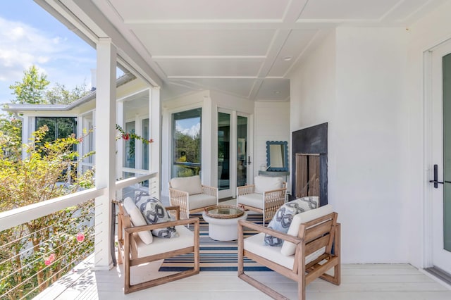 sunroom with coffered ceiling and a healthy amount of sunlight