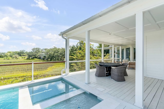 view of swimming pool featuring a wooden deck