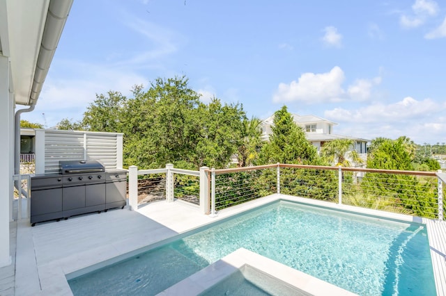 view of swimming pool with a grill