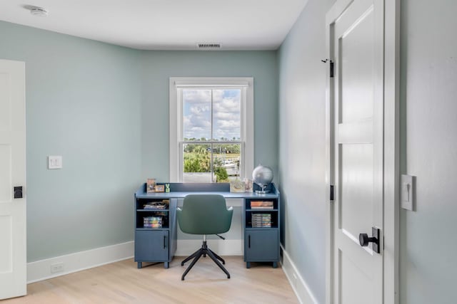 office space with light wood-type flooring