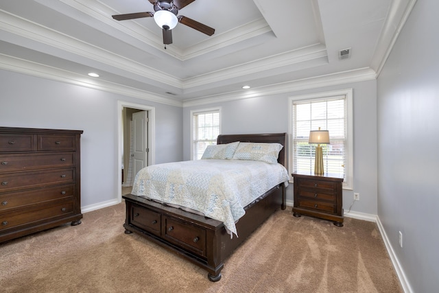 bedroom featuring crown molding, visible vents, light carpet, and a raised ceiling