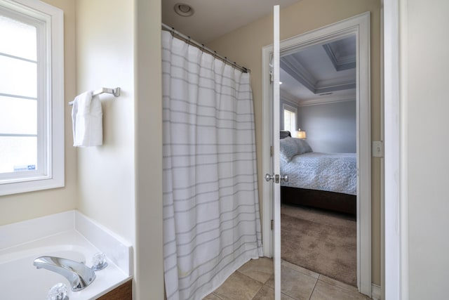 ensuite bathroom with crown molding, tile patterned floors, ensuite bathroom, a shower with curtain, and a garden tub