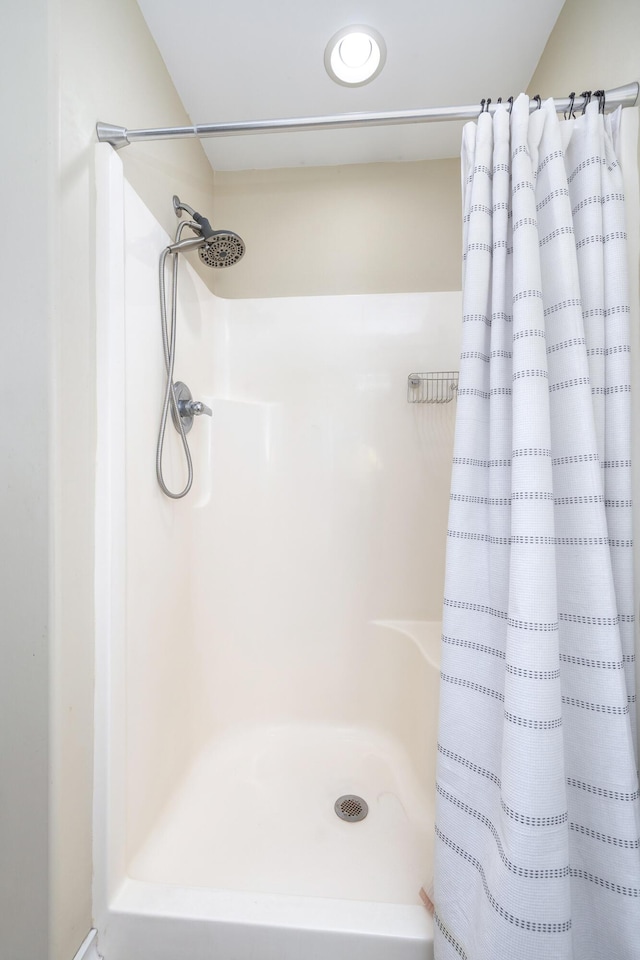 bathroom with curtained shower