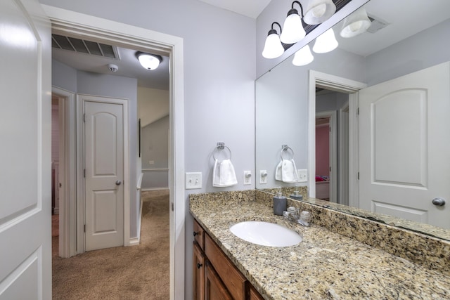 bathroom with visible vents and vanity