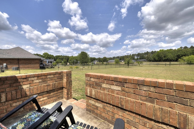 view of patio / terrace featuring a fenced backyard and a rural view
