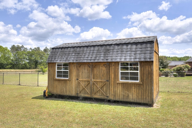 view of shed with fence