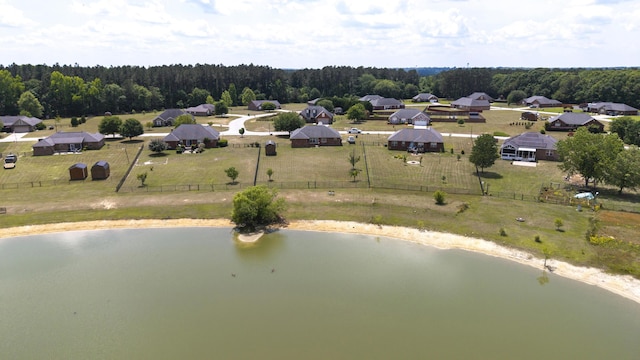 bird's eye view featuring a water view and a view of trees