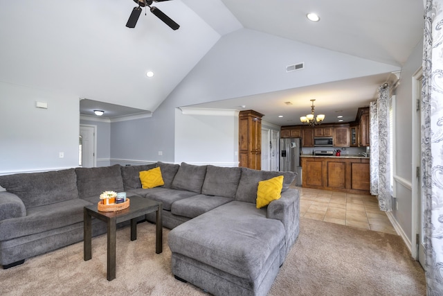 living area with visible vents, recessed lighting, ceiling fan with notable chandelier, and light colored carpet
