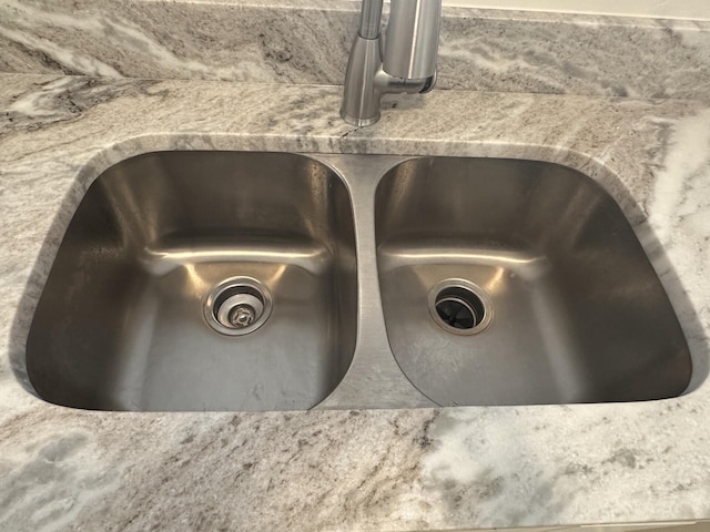 details with sink and stone countertops