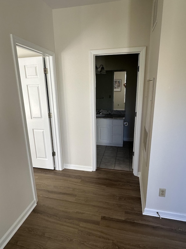 corridor with dark wood-type flooring