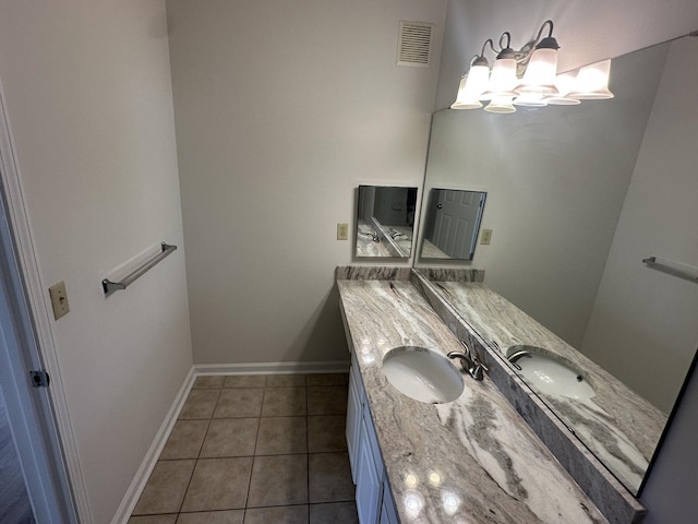 bathroom with tile patterned flooring and vanity