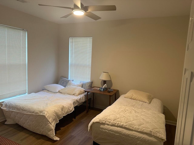 bedroom featuring dark wood-type flooring and ceiling fan