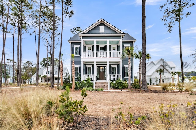 view of front of house with a porch and a balcony