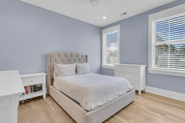 bedroom featuring a ceiling fan, baseboards, visible vents, light wood finished floors, and recessed lighting