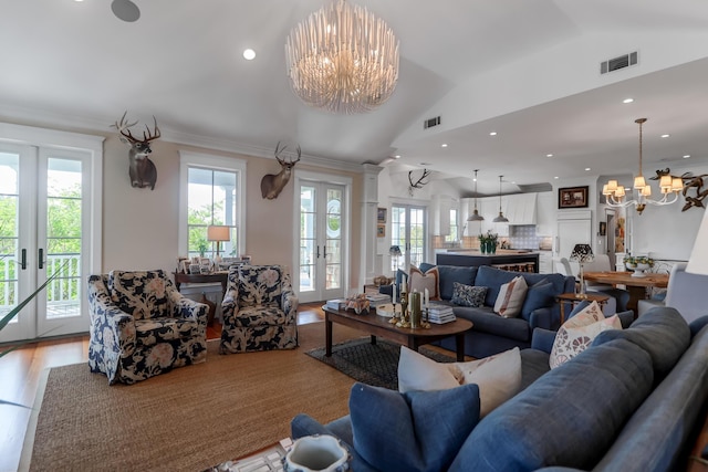 932 Middle St, Sullivans Island, SC 29482 - living room featuring a chandelier, french doors, light wood finished floors, vaulted ceiling, and recessed lighting