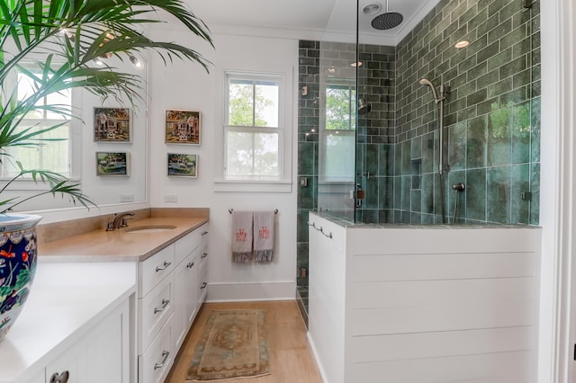 932 Middle St, Sullivans Island, SC 29482 - full bath with a tile shower, vanity, wood finished floors, and ornamental molding