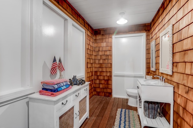 932 Middle St, Sullivans Island, SC 29482 - bathroom featuring hardwood / wood-style flooring, vanity, and wooden walls