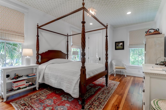 932 Middle St, Sullivans Island, SC 29482 - bedroom with multiple windows, wood finished floors, ornamental molding, and recessed lighting