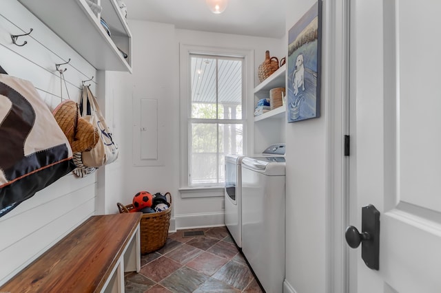 932 Middle St, Sullivans Island, SC 29482 - laundry room featuring separate washer and dryer, healthy amount of natural light, electric panel, and dark stone finish floors