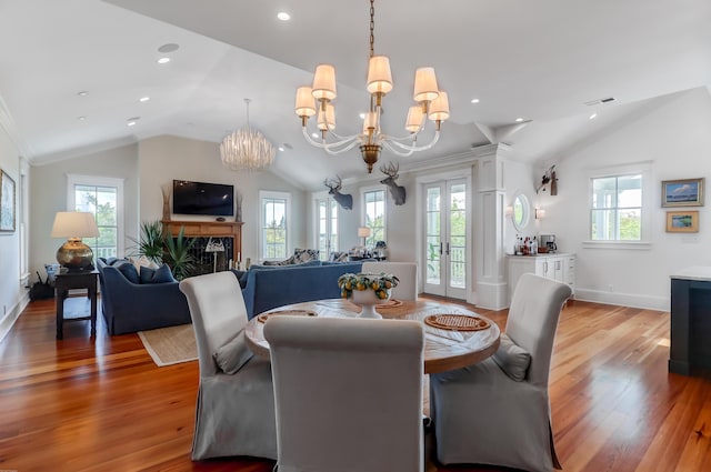 932 Middle St, Sullivans Island, SC 29482 - dining room featuring vaulted ceiling, a chandelier, healthy amount of natural light, wood finished floors, and french doors