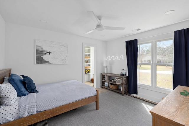 bedroom with ceiling fan, visible vents, and baseboards