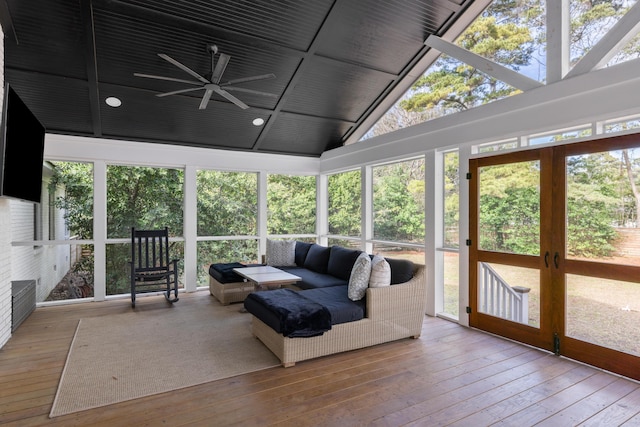 sunroom / solarium featuring ceiling fan and lofted ceiling