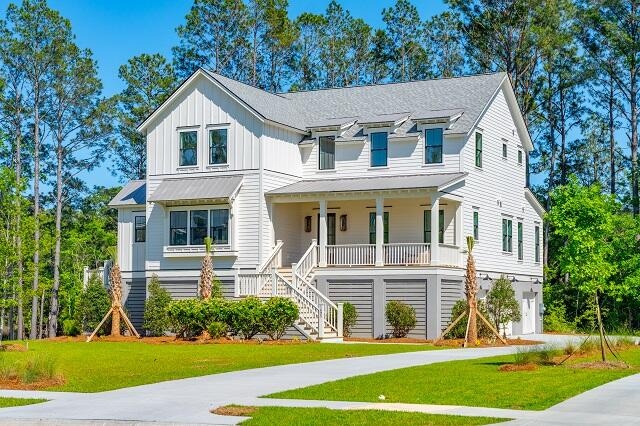 view of front of home with a front yard and covered porch