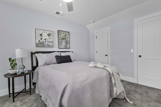 bedroom with visible vents, baseboards, carpet, vaulted ceiling, and a ceiling fan