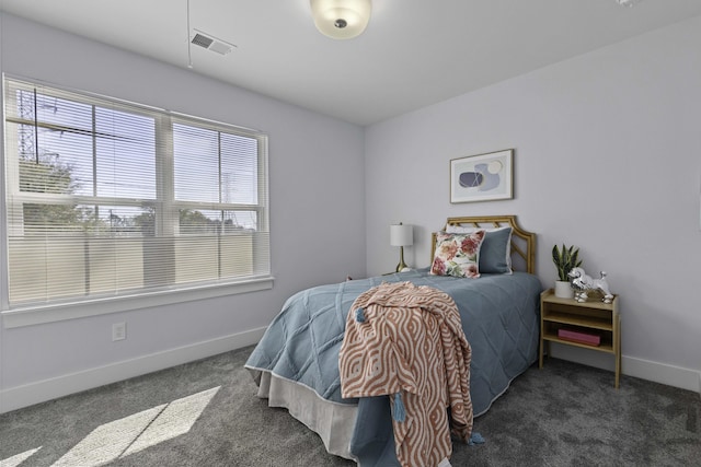 carpeted bedroom with baseboards and visible vents